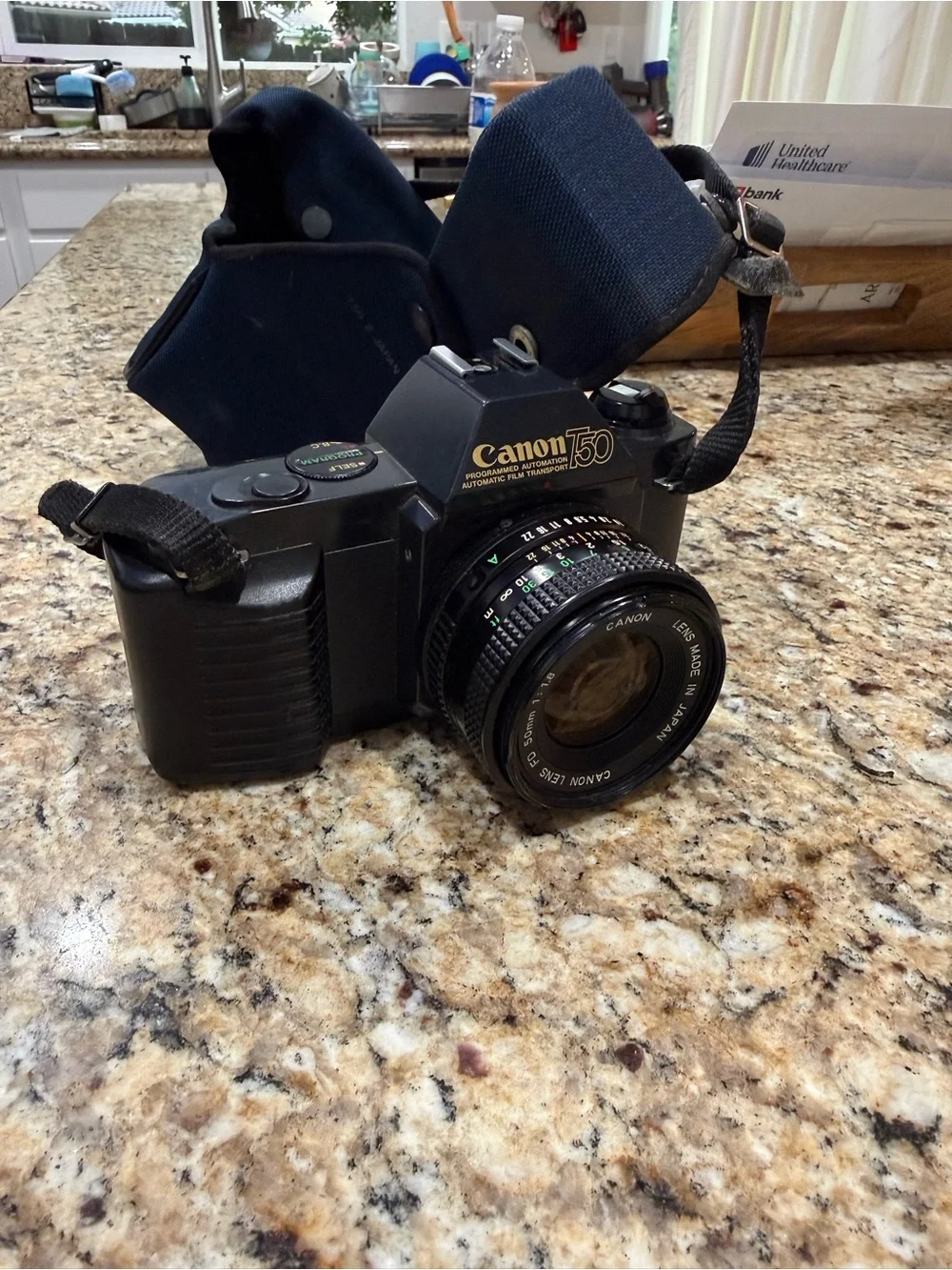Canon T50 Black 35mm SLR Camera with Attached Lens